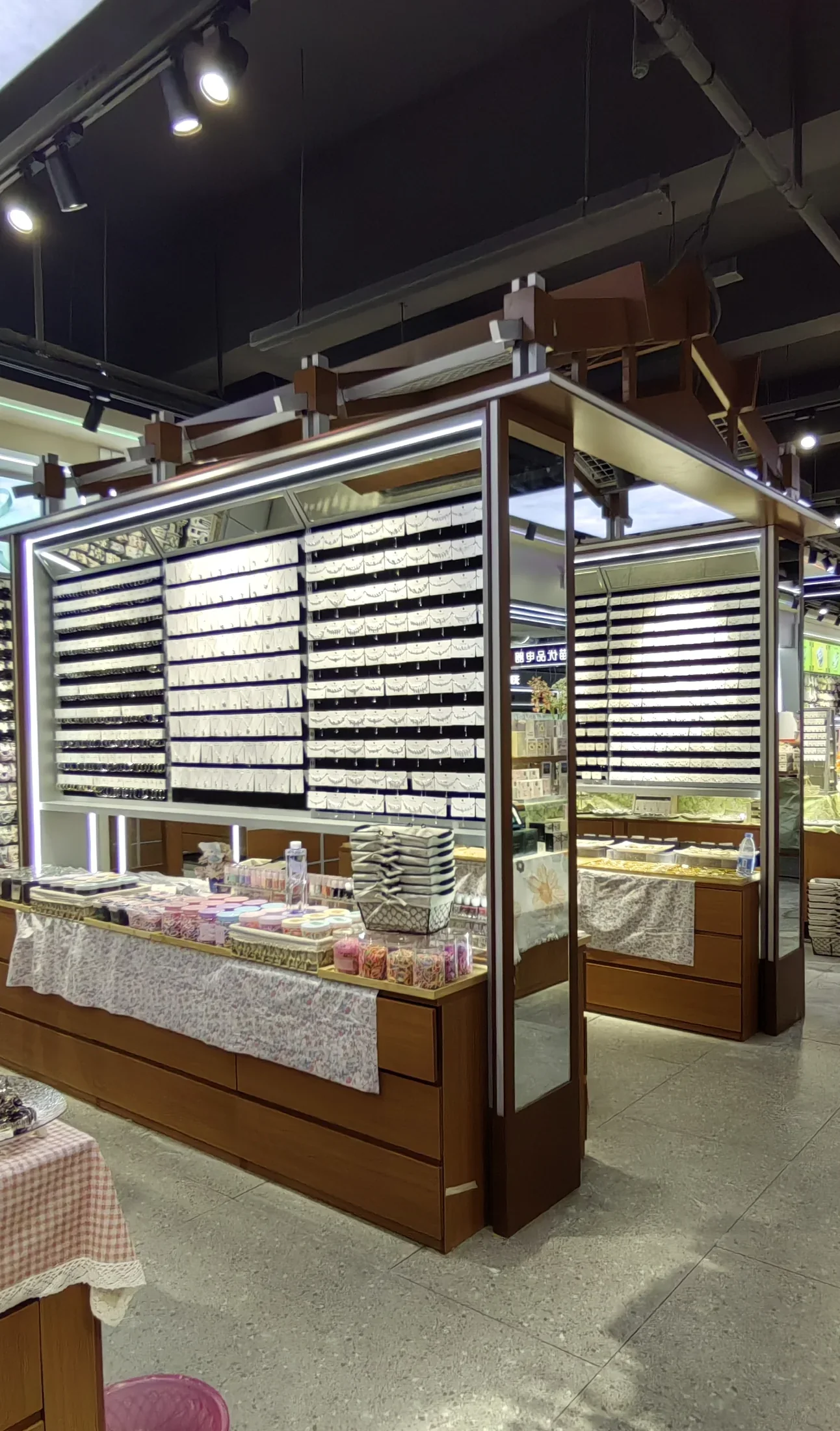 Roof-shaped island display with merchandise inside the Dongguan Chaowushi retail store